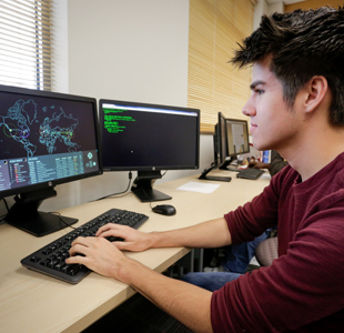 Student using a computer at a table