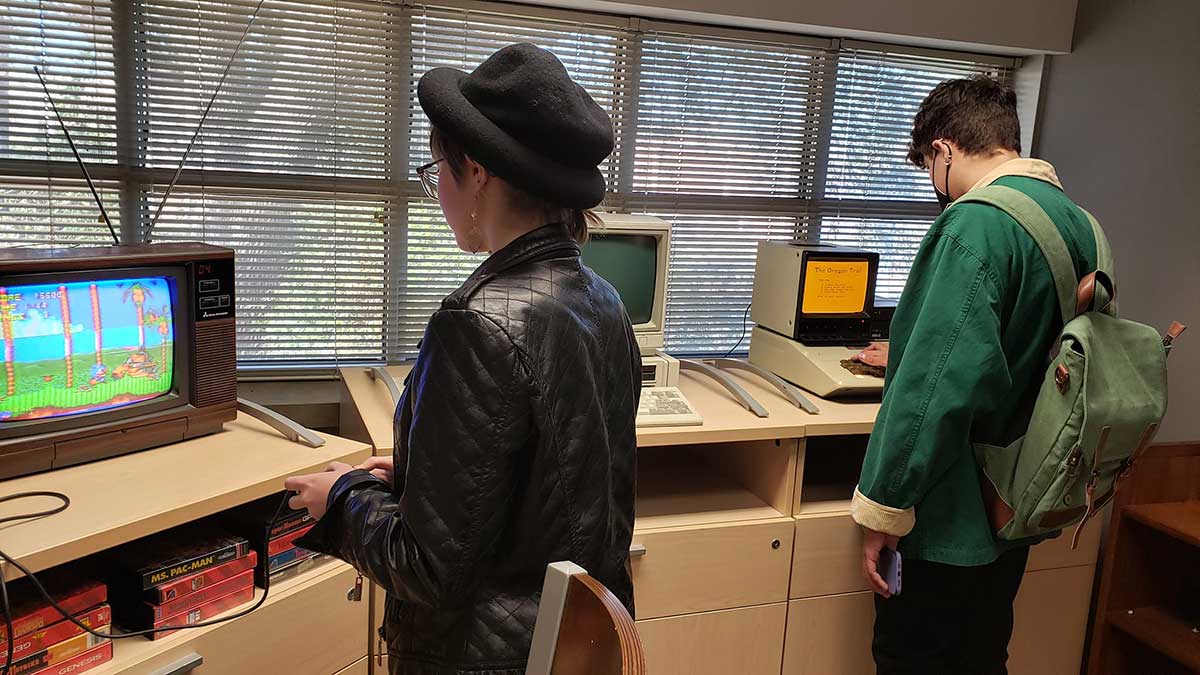 students using vintage computers and game colsoles