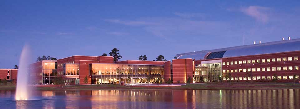 The PSC building from across the lake on the Macon Campus.