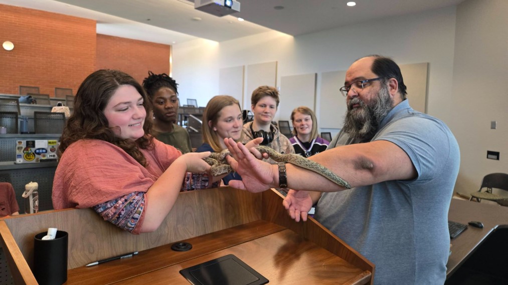 MGA students visiting with a non-venomous snake.