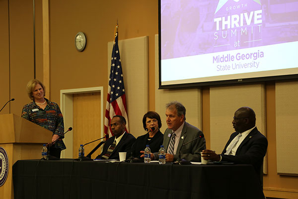 Presidents from area colleges and universities participate in a panel discussion