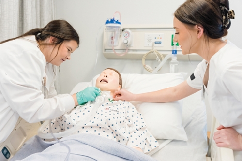 MGA nursing students practice vitals during clinicals at the Dublin Campus nursing lab.