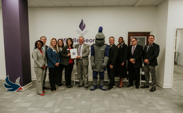robins federal representative stand with MGA representatives and knight mascot Duke